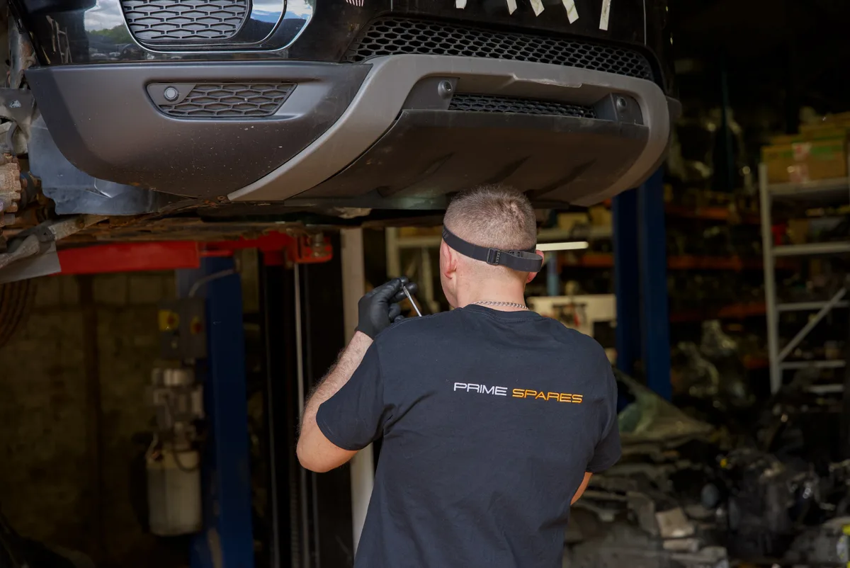 Prime Spares team member dismantling a vehicle